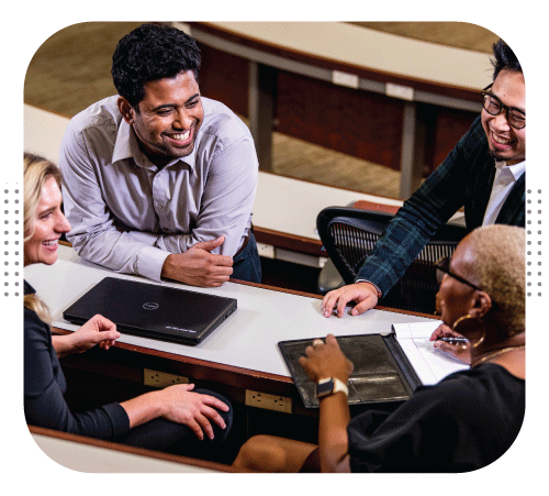 Students talking to an advisor.