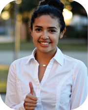 Female business student making a thumbs-up gesture.