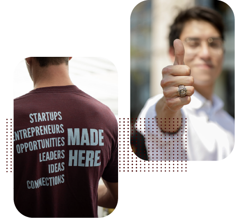 A student showing the back of his Mays shirt and another student giving a thumbs up.