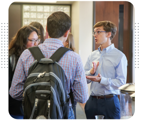 A group of students being advised.