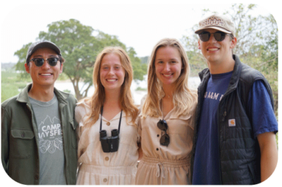 Four students smiling on study abroad.