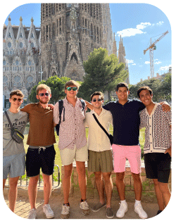 Six students pose in Spain.