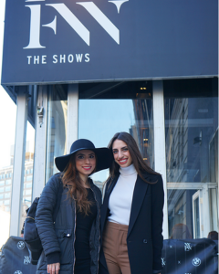 Two students smile at NYFW.