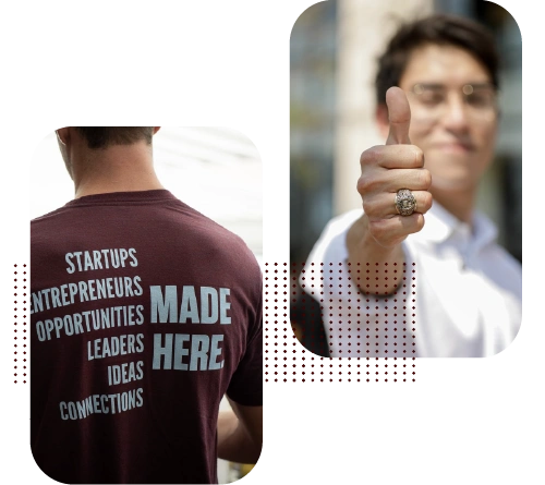 Student with Aggie Ring making a thumbs-up gesture. Student wearing a business shirt
