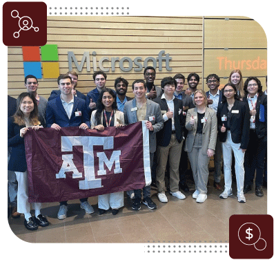 Group of students holding Texas A&M banner in front of Microsoft Headquarters.