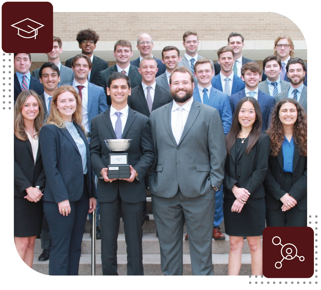 Group of students smiling and holding trophy in front of the Wehner Building.