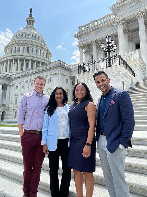 Four MBA Students standing in front of the US Capitol Building in Washington DC
