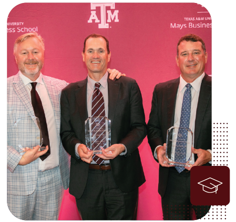 Three former students receiving the Outstanding Alumni Award.