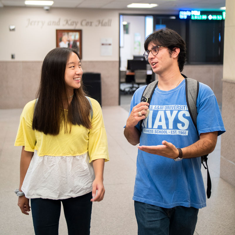 Student smiling on campus.