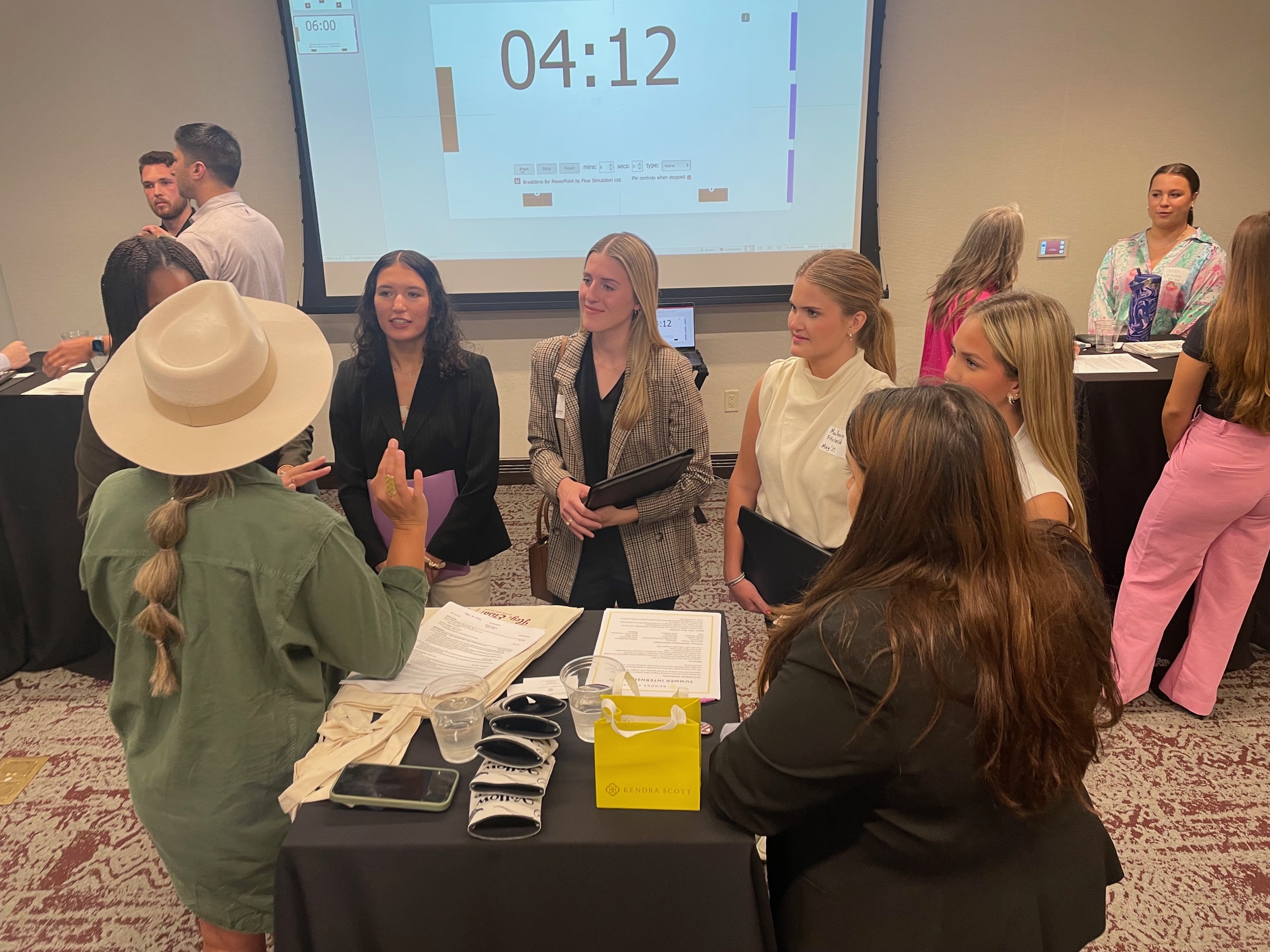 Students at a Speed Networking Event, talking to a company representative.