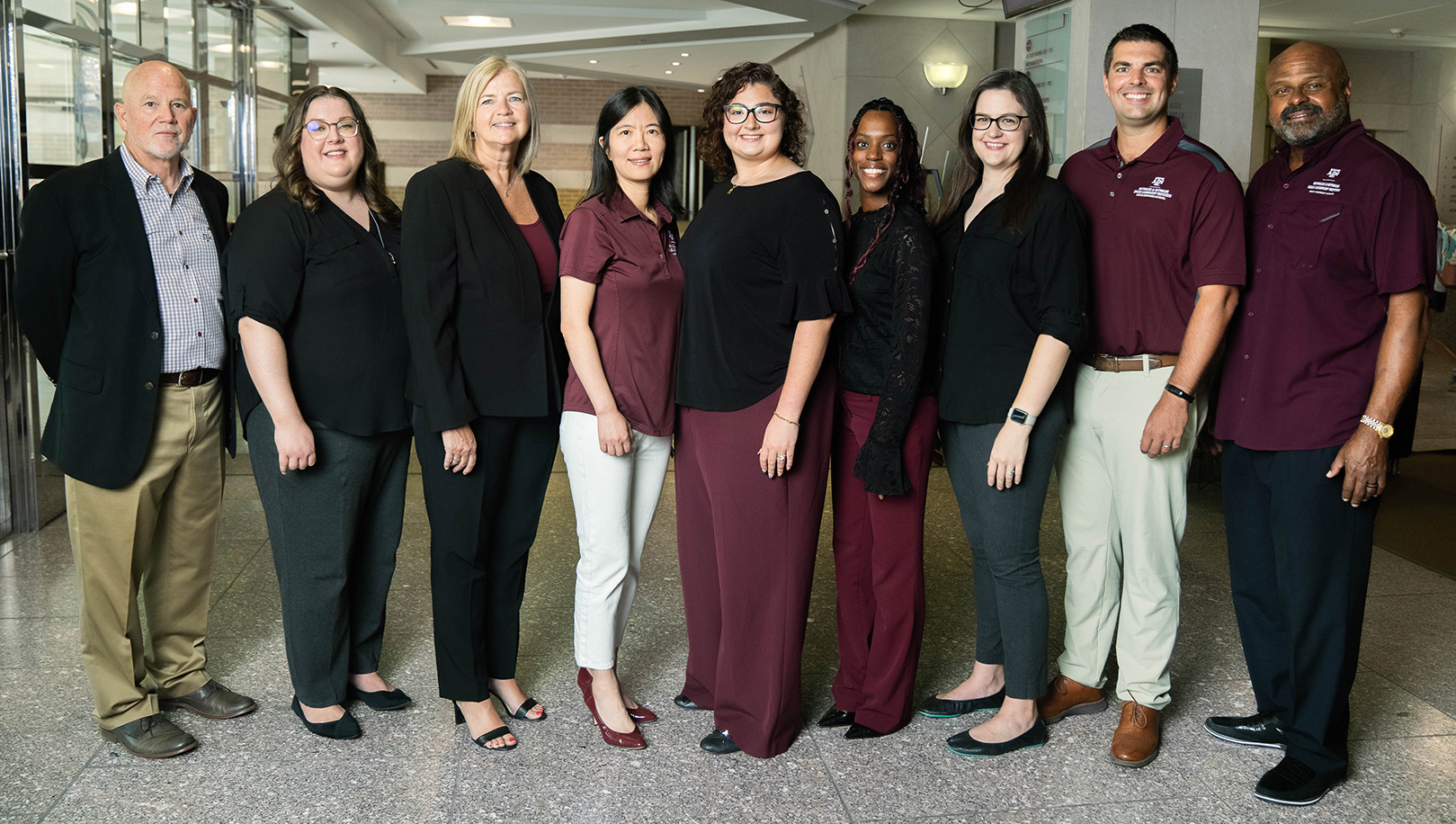 Photo of the Sales Leadership Institute Team standing a line side-by-side