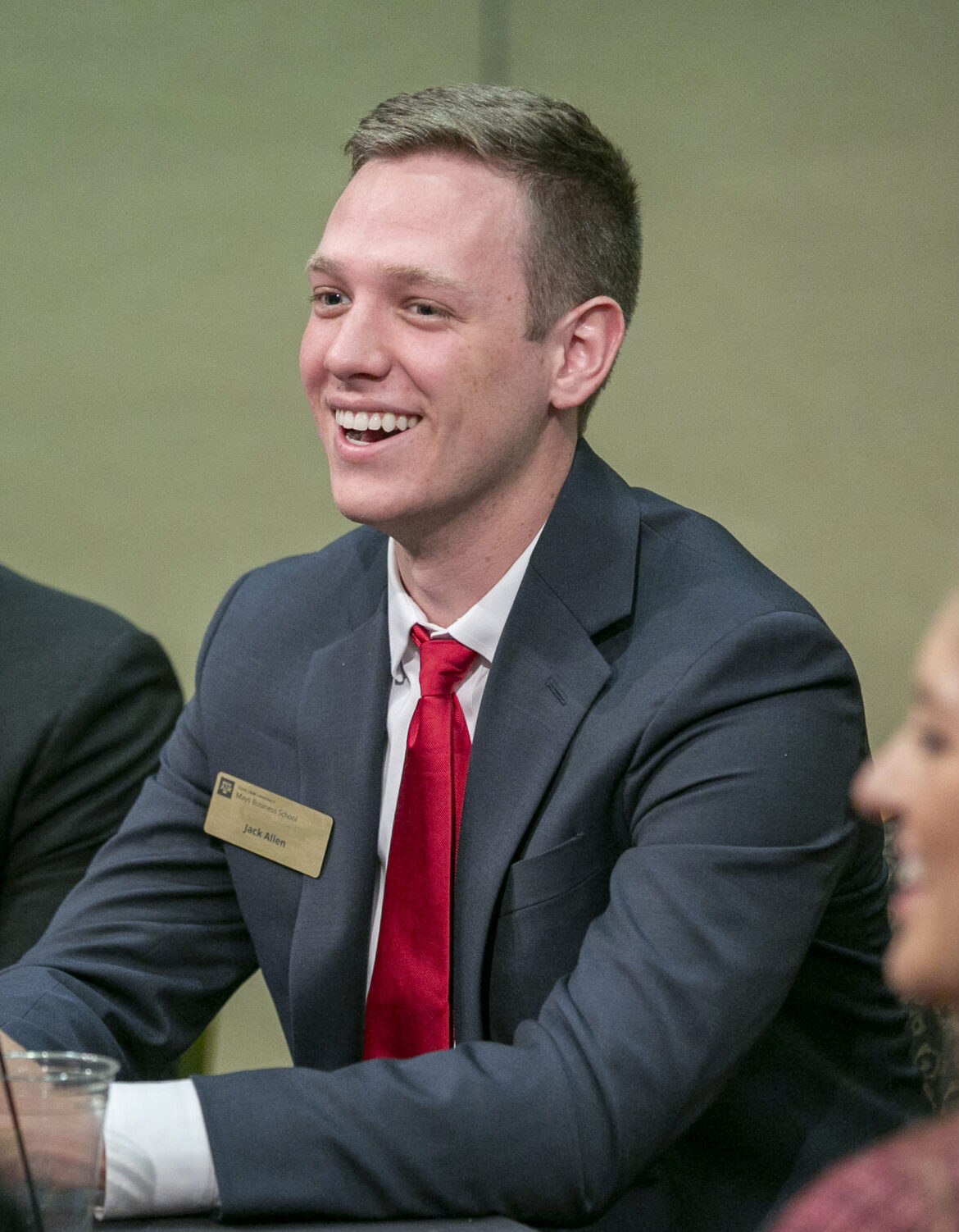 Student in business clothes having a conversation.