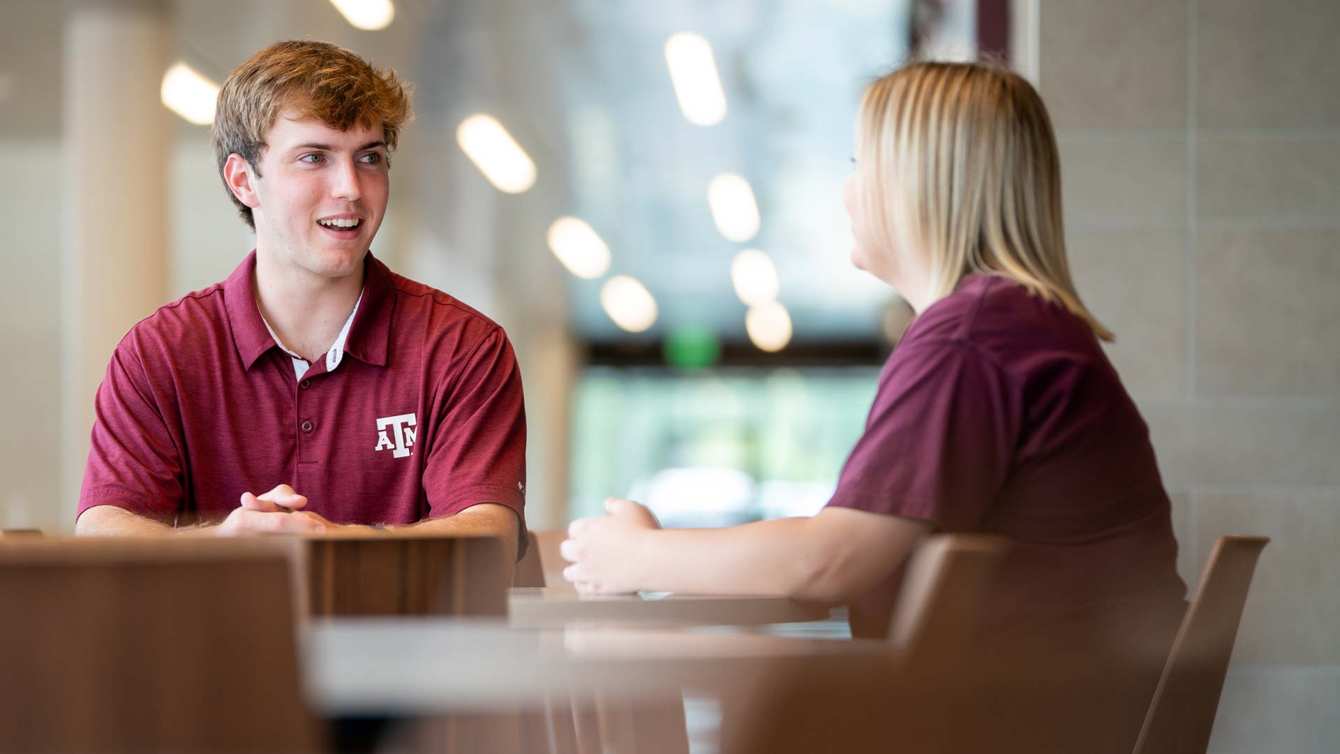 Three women posing at the Women's Leadership Initiative conference.