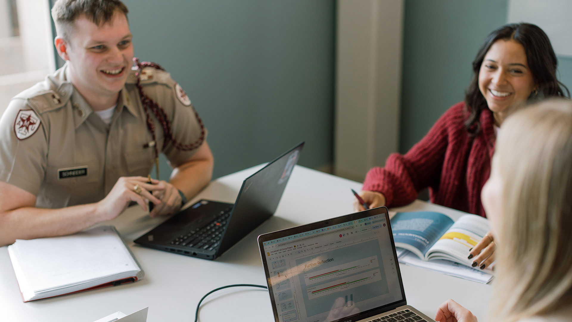 Students sitting around a table and working