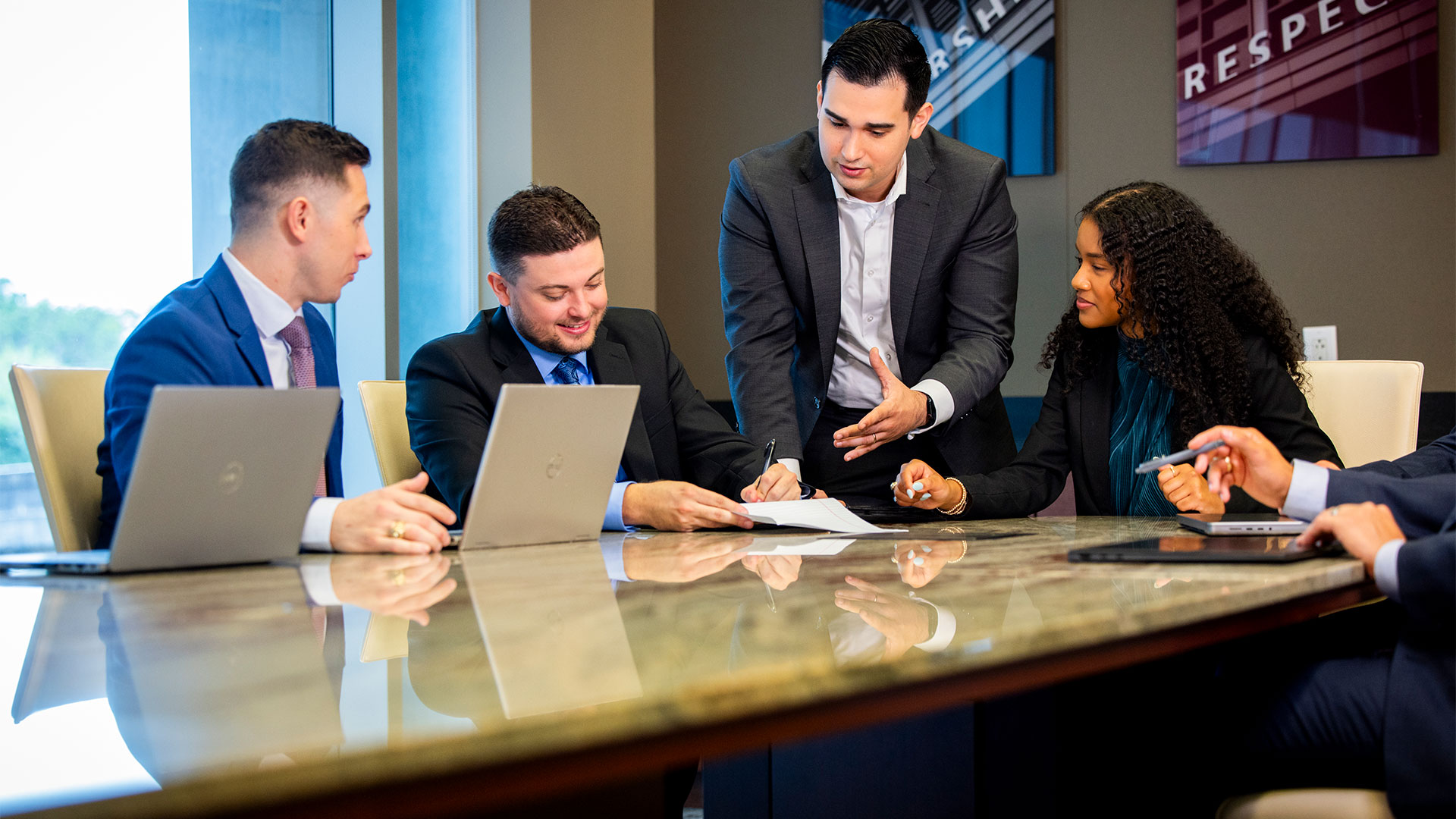 professional mba students having a discussion in a meeting room