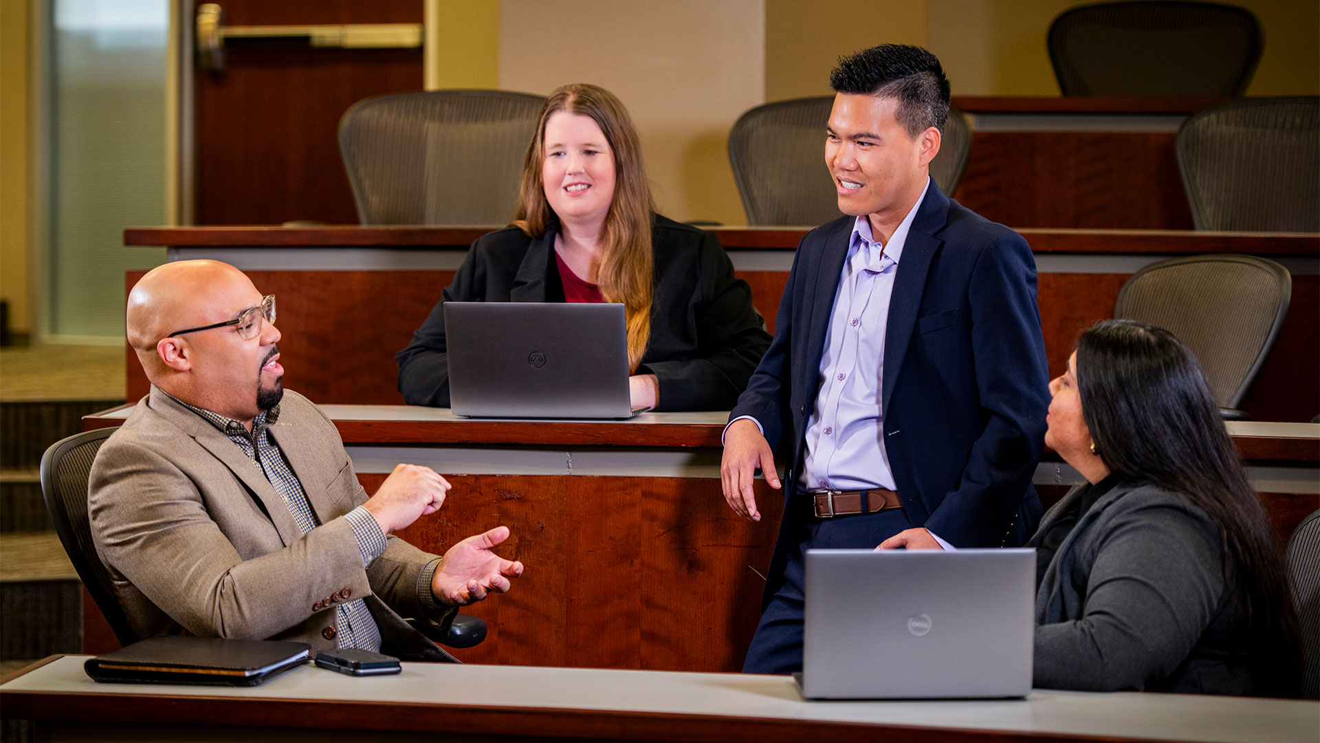 MB + MS students having a discussion in a classroom