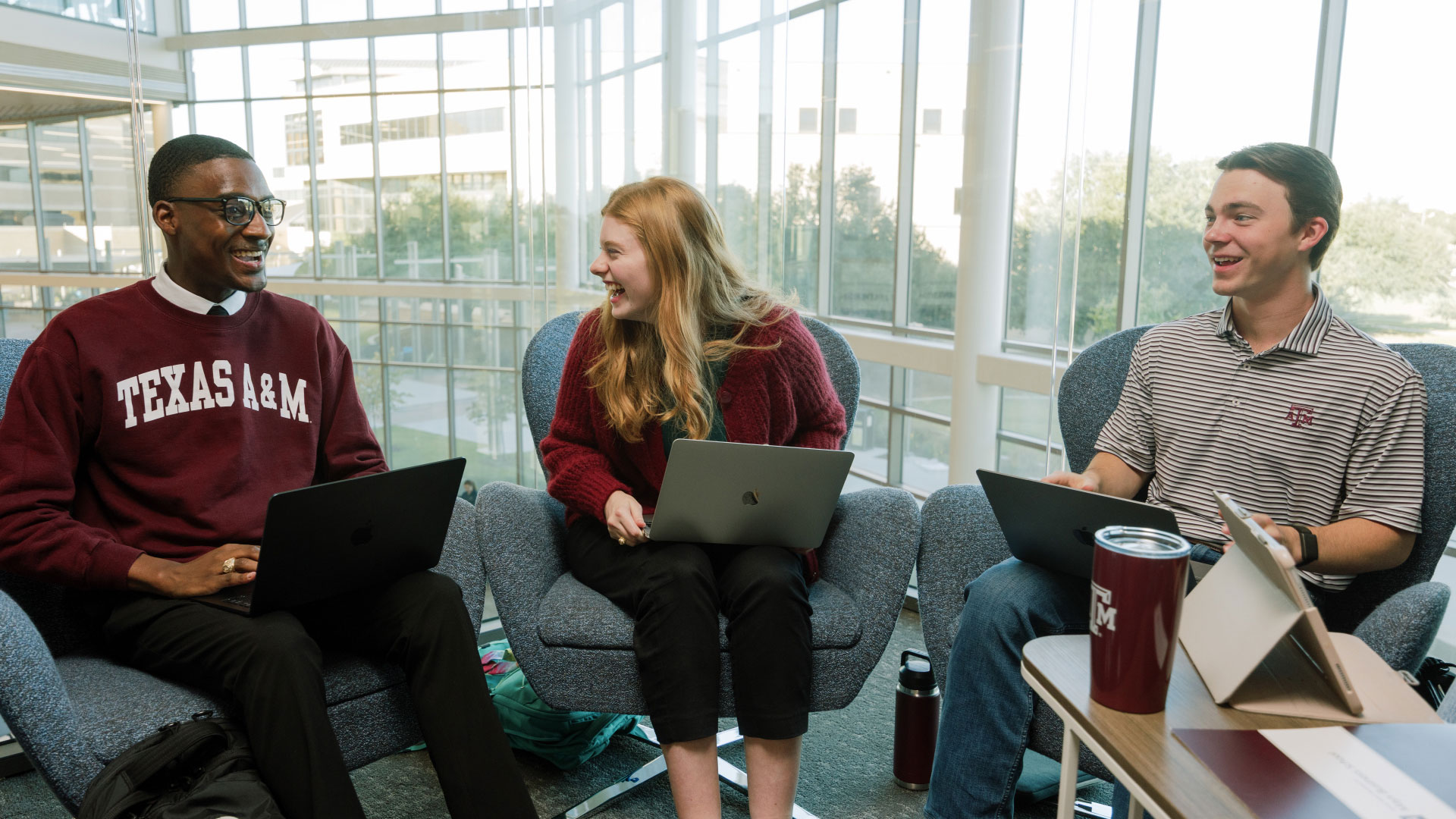 Students smiling and having a discussion