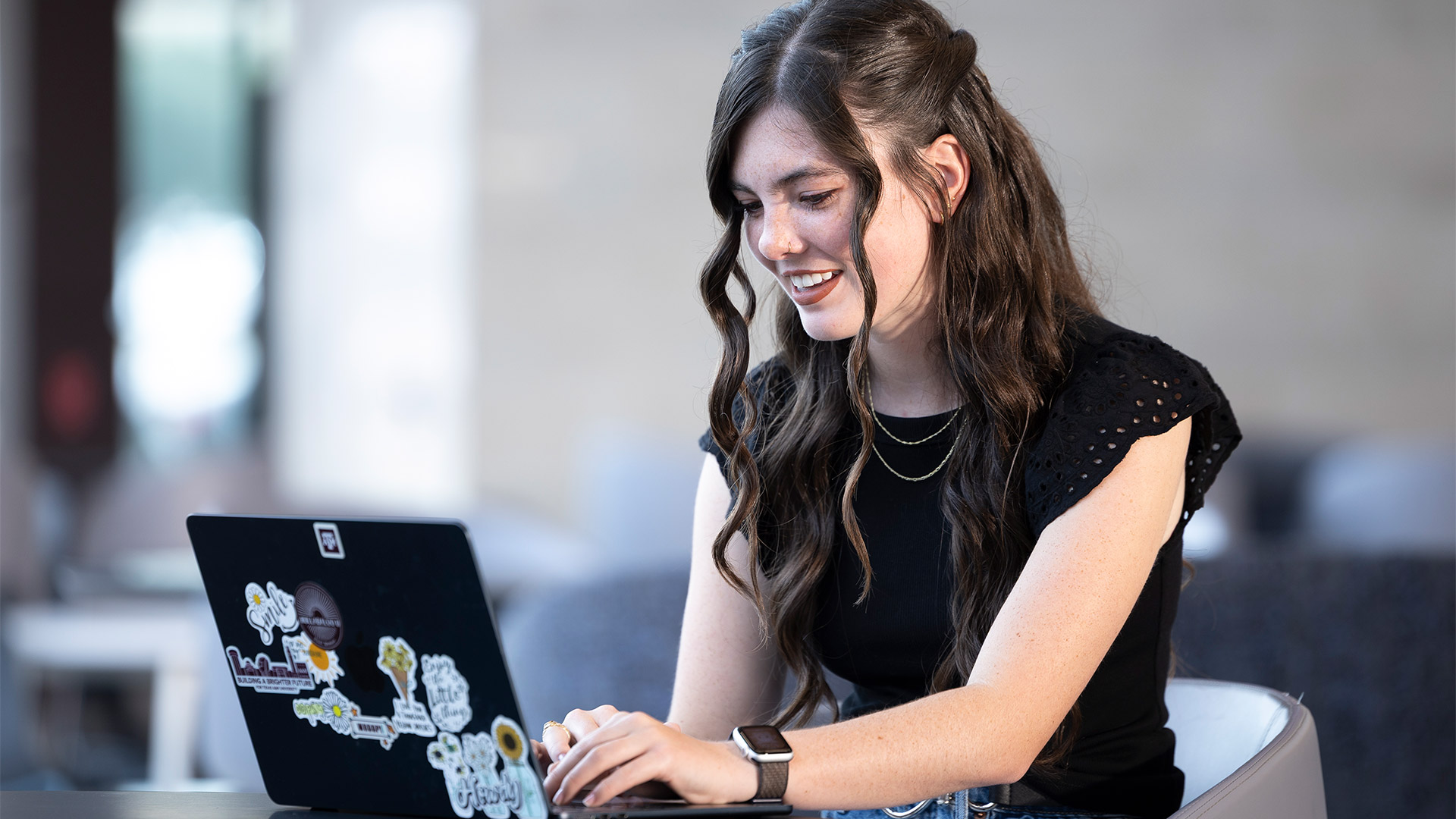 a girl working on her laptop