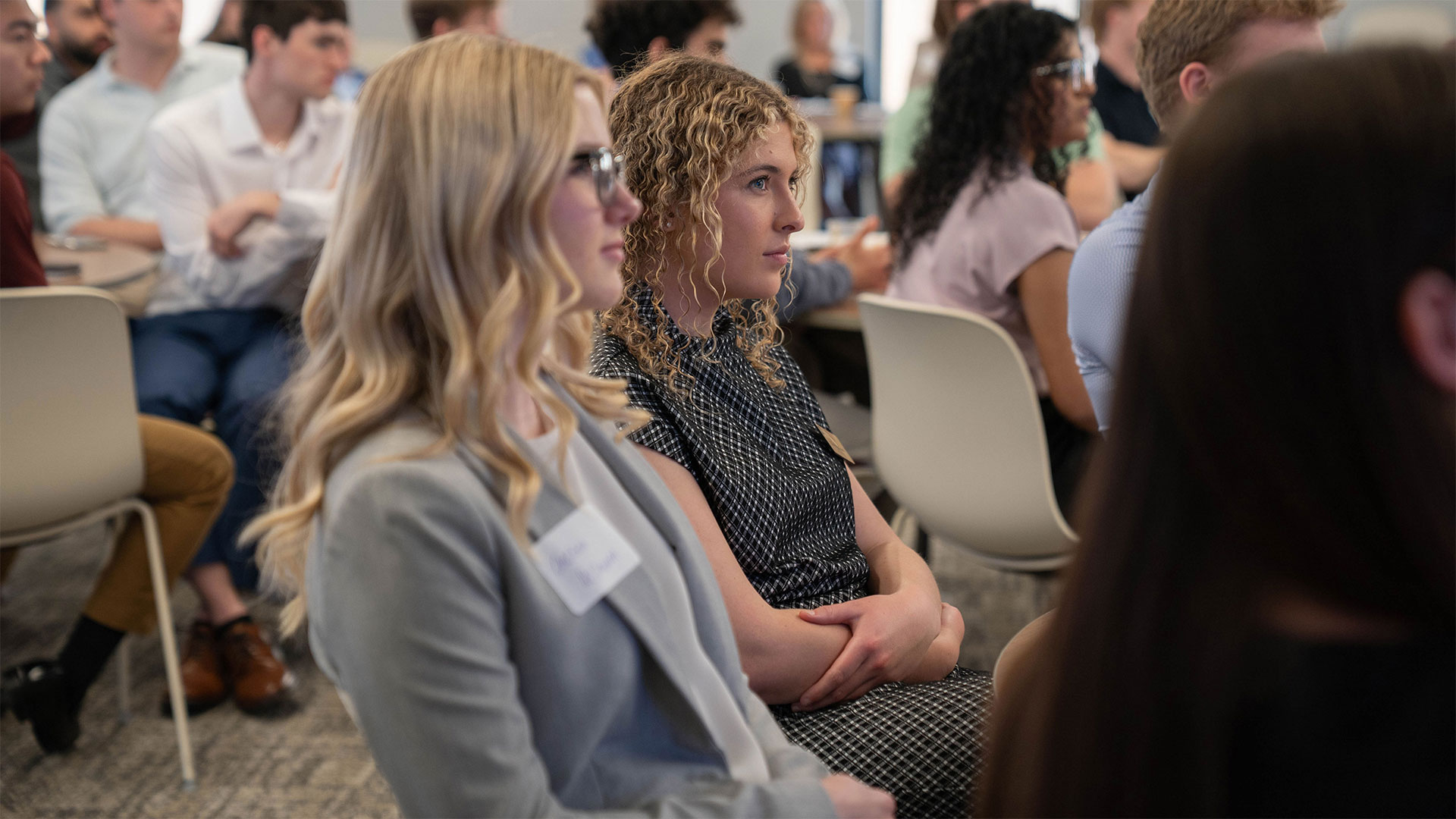 Focus on two students at an event