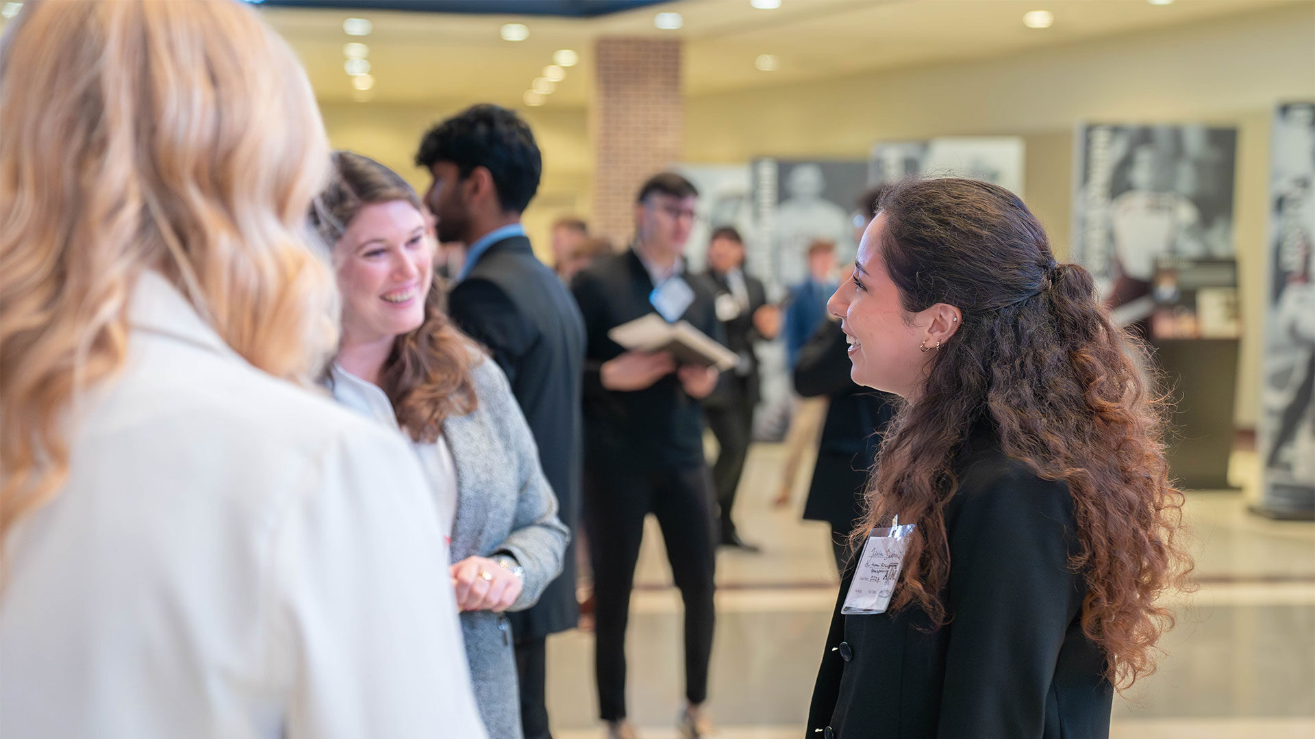 Student talking to members of a student organization