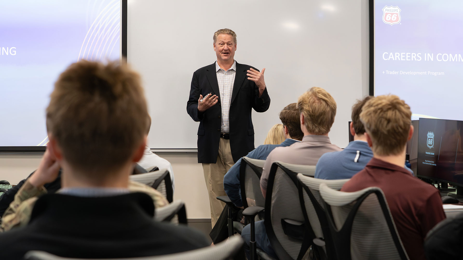 A professor lecturing a class of students